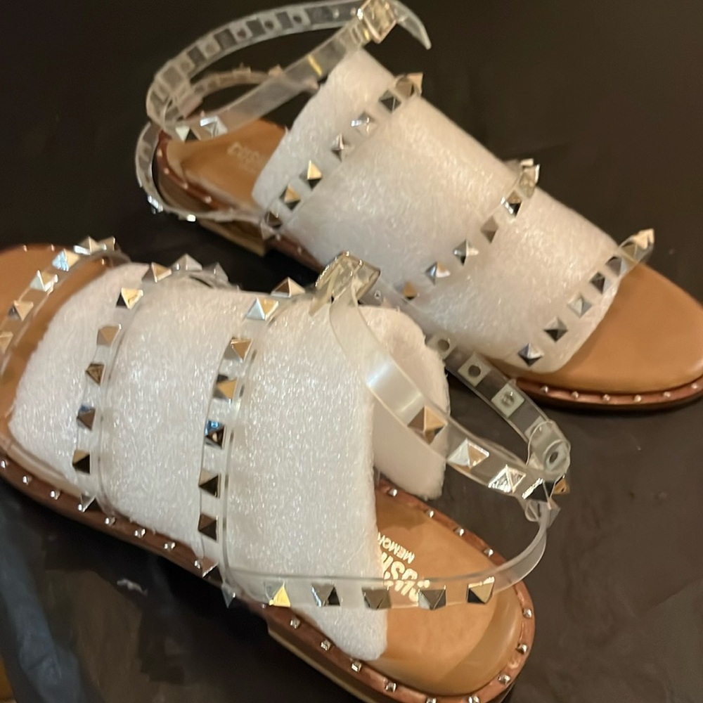 Clear, sandal with straps and spikes.  Size 9, new.